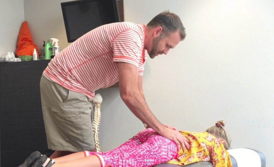 airdrie chiropractor dr paul bajor shows how he adjusts kids