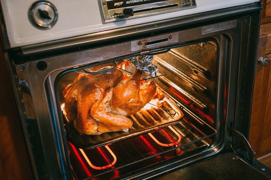 A large turkey in a hot oven